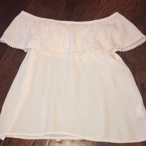 a white off the shoulder top